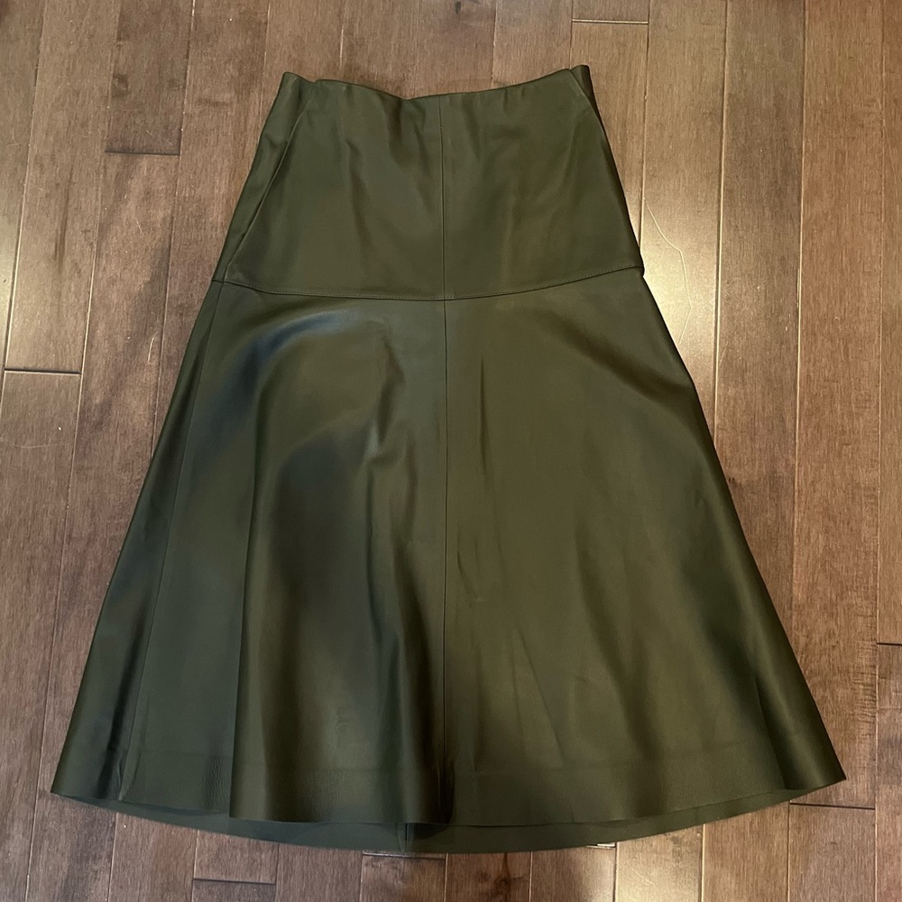 COS Dark green leather skirt. A-line shape with front pockets. Never worn.